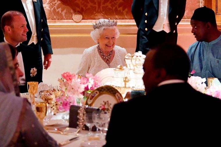 Queen Elizabeth II with guests at a banquet| Image: Pinterest