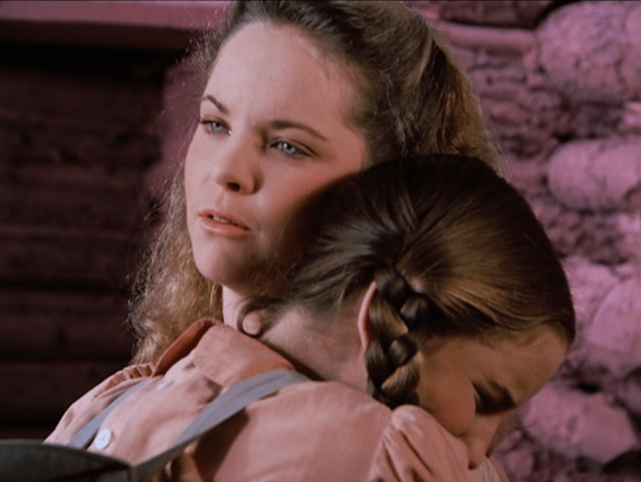 Laura and Mary Ingalls share a hug | Image: Pinterest