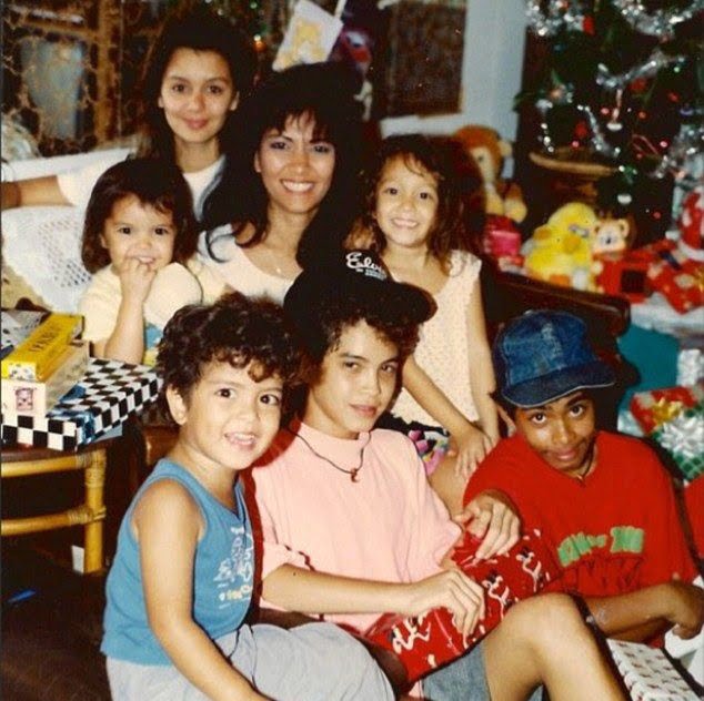 Bruno Mars as a child with his mom and siblings | image: Pinterest