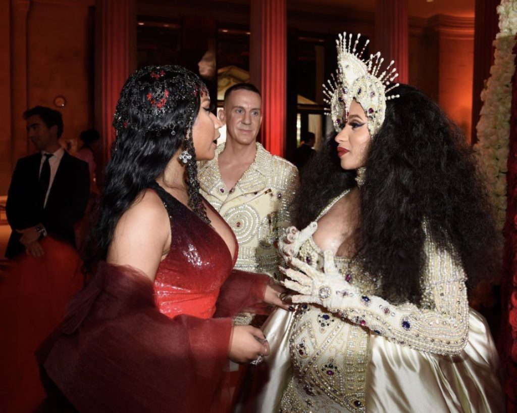 Nicki Minaj and Cardi B interact at a red carpet event | Image: Pinterest
