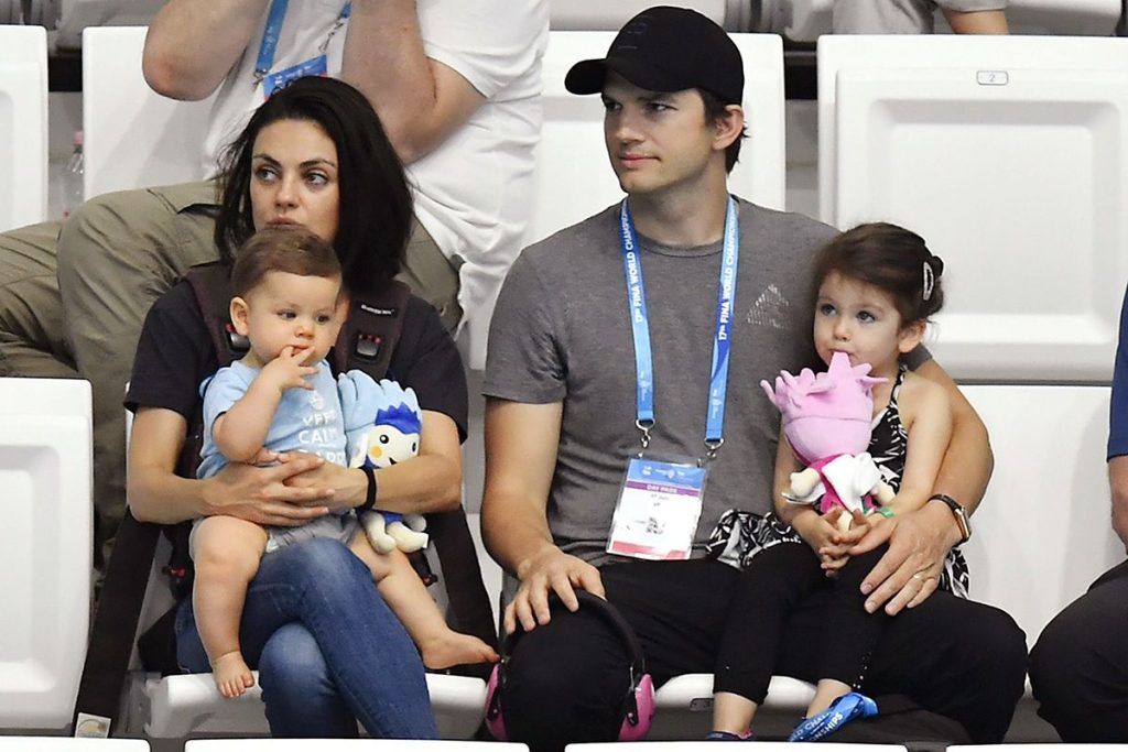Mila Kunis and her husband with their kids
