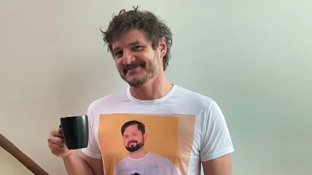 Pedro Pascal holding a mug