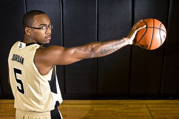 Marcus Jordan holding a basketball