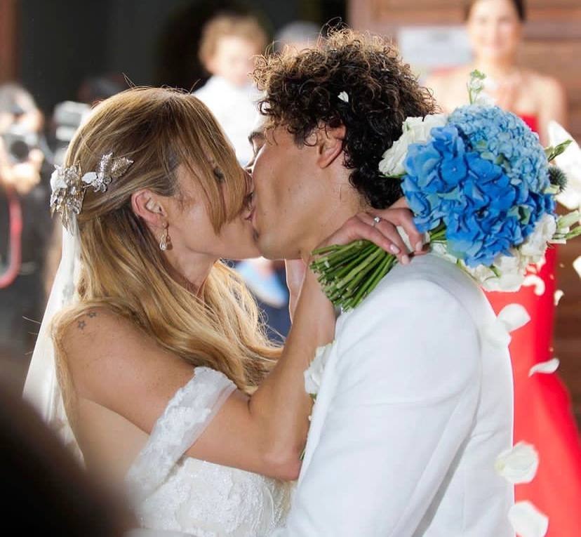A picture of Karla Mora and her husband kissing at their wedding