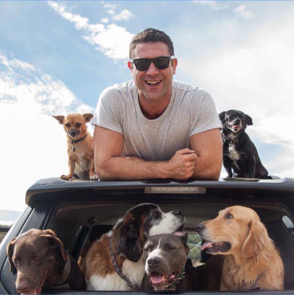 A picture of Lee Asher and his rescue dogs