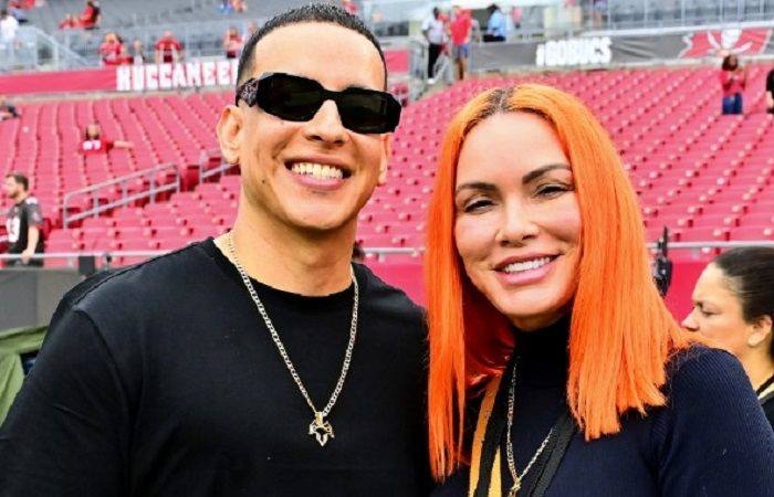 A picture of Daddy Yankee's wife and her husband.