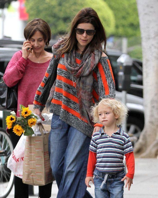 A picture of Neve Campbell and Caspian Feild.