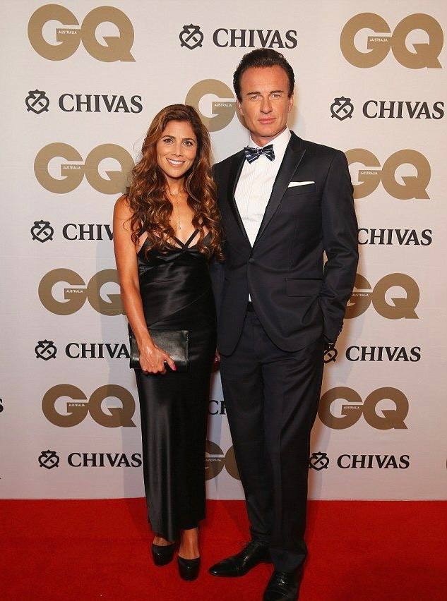 A picture of Kelly Paniagua and her husband at an event.