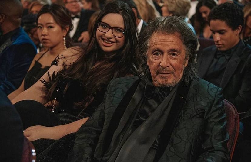 A picture of Olivia Pacino and her father at an event.