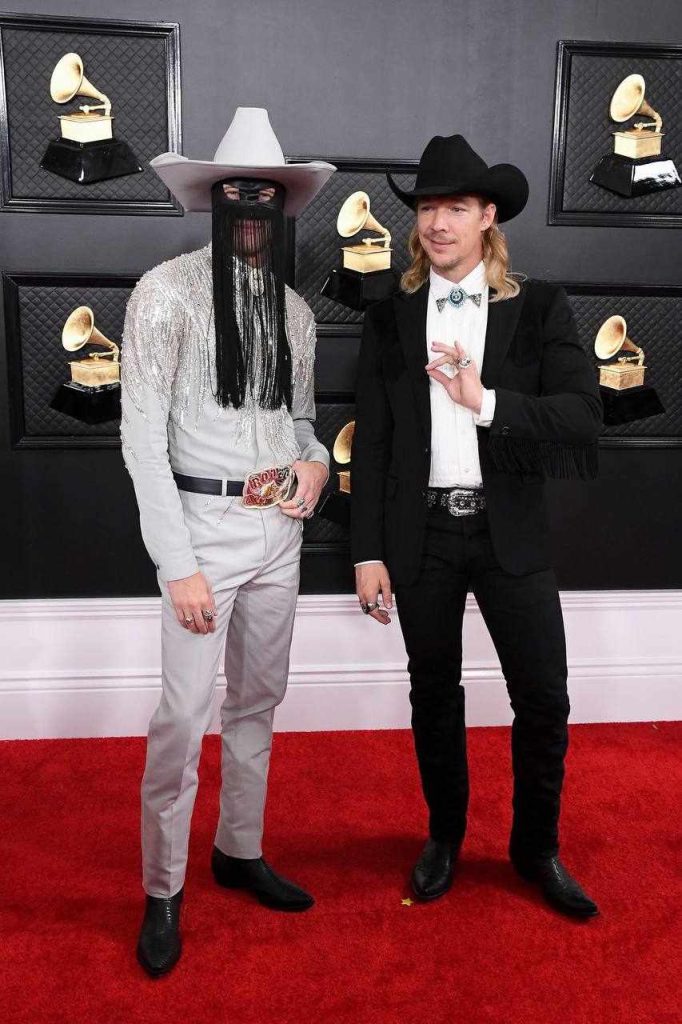 A picture of Daniel Pitout's Orville Peck persona and Diplo at the 2020 Grammys.