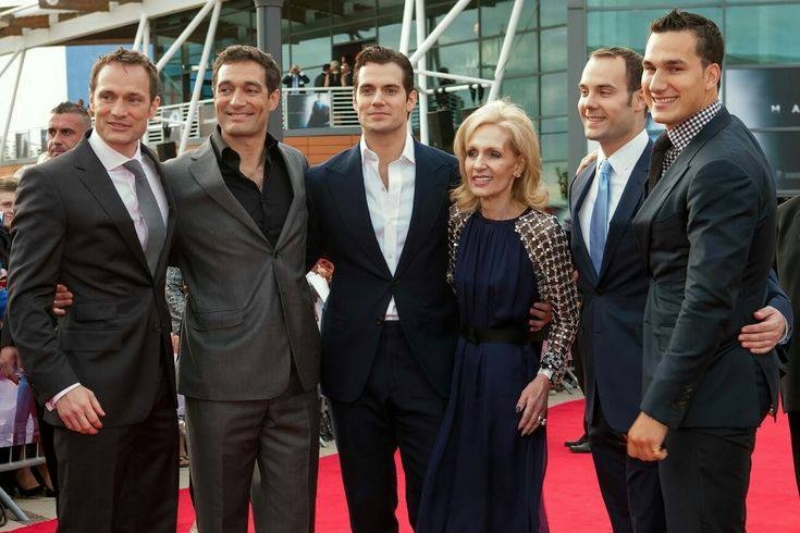 A picture of Simon Cavill with his brothers and their mom.
