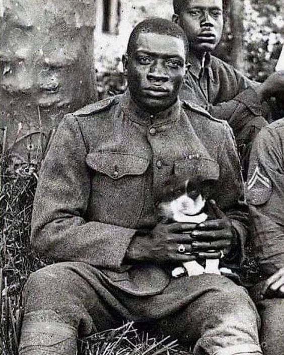A black soldier with his dog