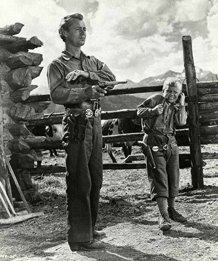 A picture of actor Alan Ladd with a Colt M1873 