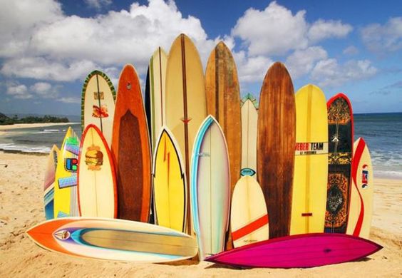 Piled Up Surf Boards on a Beach