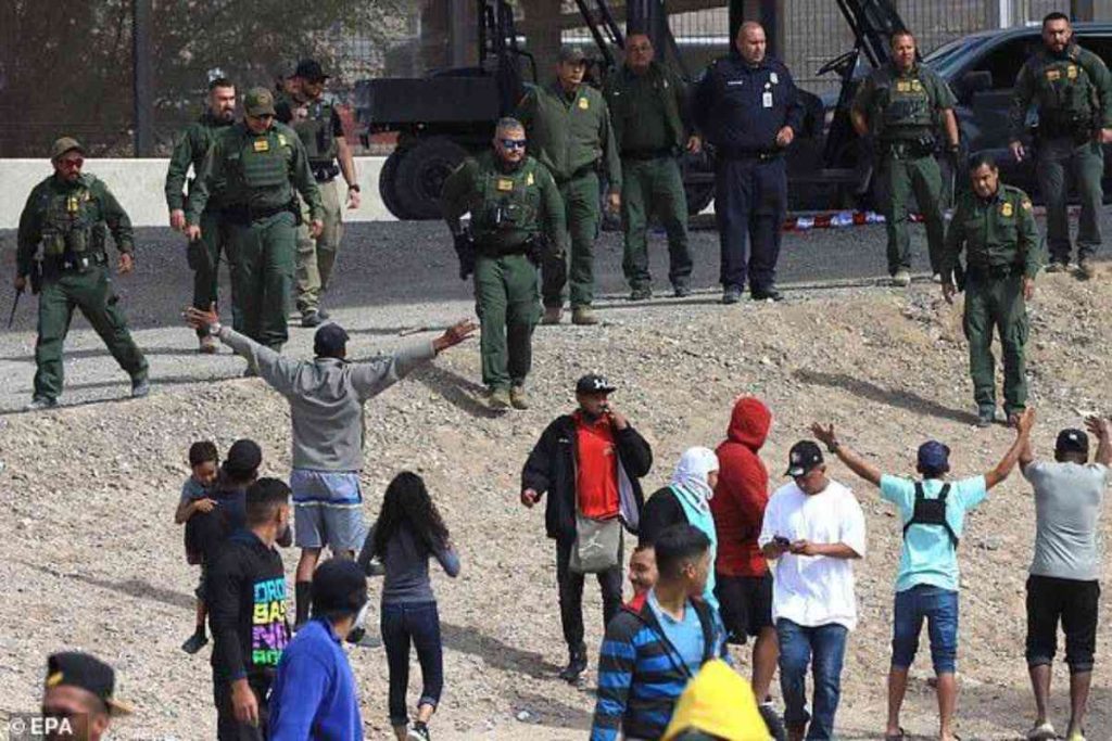 A picture of the Texas border patrol agents and some illegal immigrants