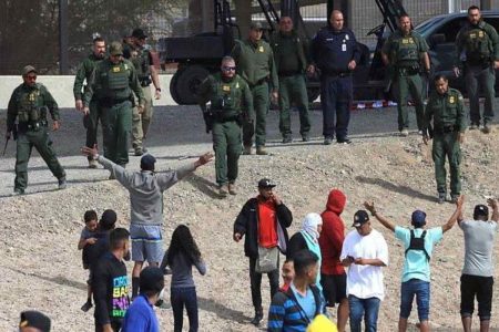 A picture of Texas border patrol agents and illegal immigrants