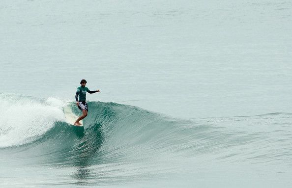 Joel Tudor catching a wave 