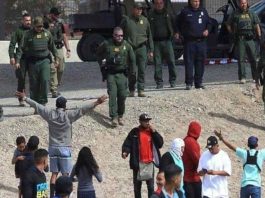 A picture of Texas border patrol agents and illegal immigrants