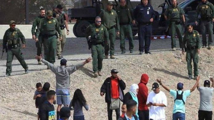 A picture of Texas border patrol agents and illegal immigrants