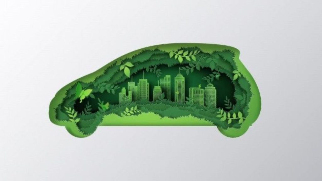 An illustration of a car with green leaves, grass and buildings