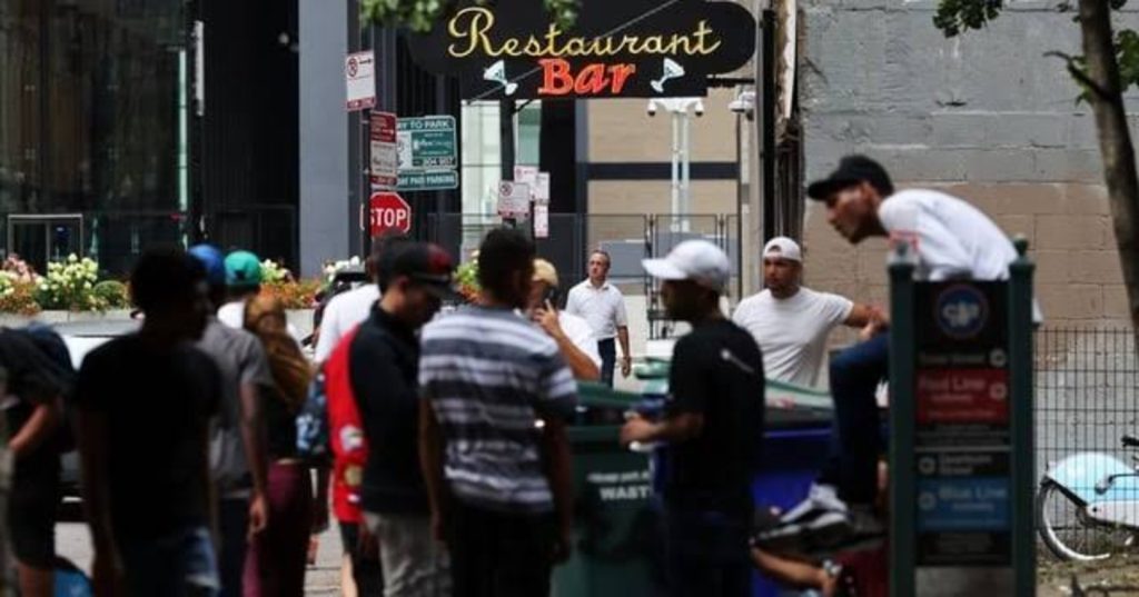 Migrants seek shelter outside a restaurant