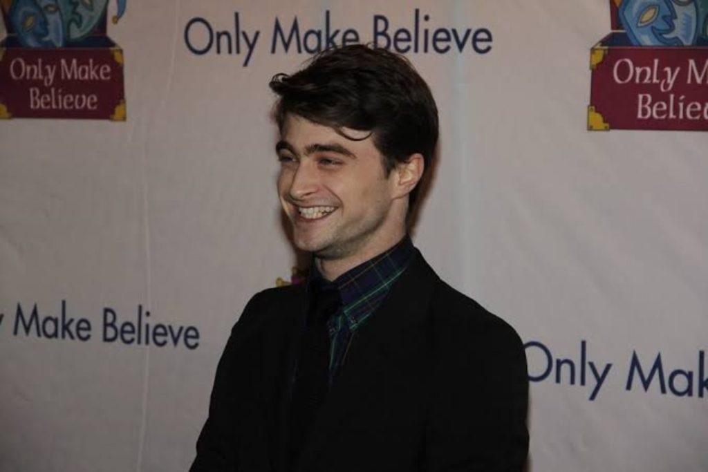 Radcliffe smiling on the red carpet