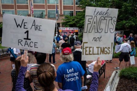 A picture of people protesting for the inclusion of Critical Race Theory in public school curricula