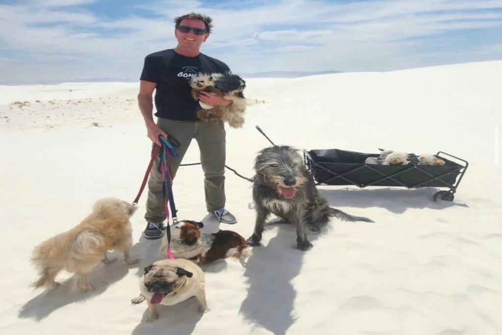 A picture of Steve Greig and his ;pack of pets