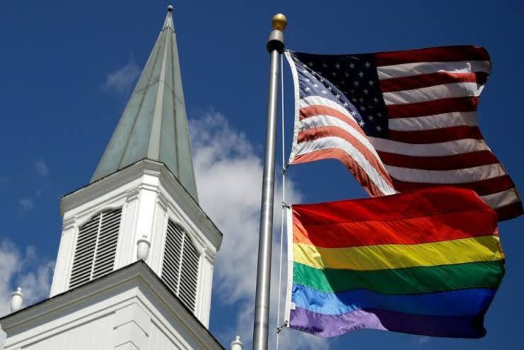 A picture of a Methodist church with a pride flag