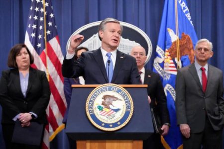 A picture of FBI Director Christopher Wray at the Wednesday, Dec. 6 conference