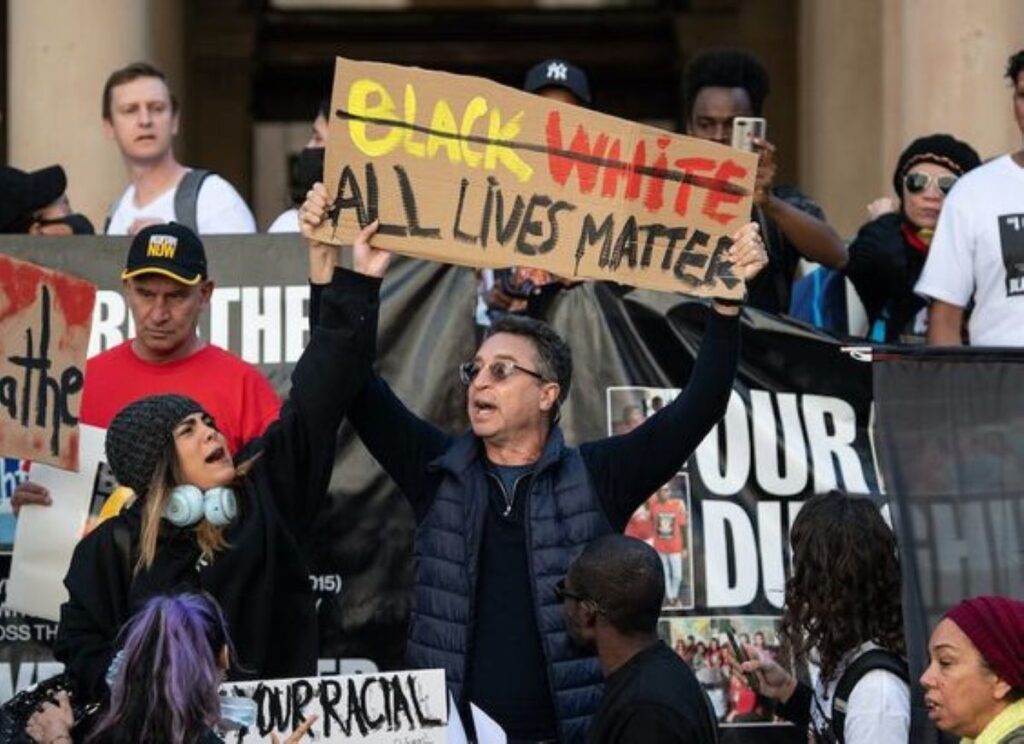 Reverse Racism Sign at a Rally