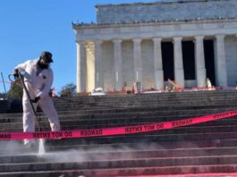 Cleaning crew working on the steps of the Lincoln Memorial