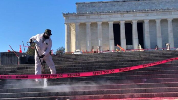 Cleaning crew working on the steps of the Lincoln Memorial