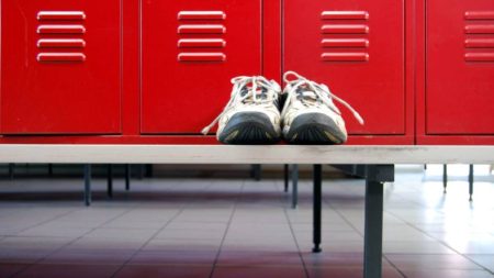 Gym shoes on a locker room seat