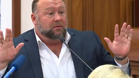 Alex Jones testifying at his defamation trial