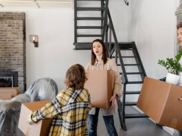 A family moving boxes into a new home