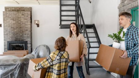 A family moving boxes into a new home