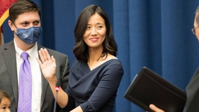 Michelle Wu being sworn in as the first woman and person of color to be mayor of Boston.