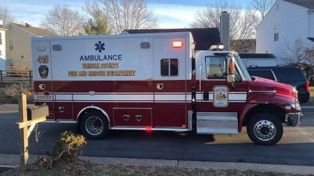 An ambulance along Apple Barrel Court