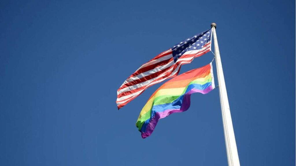 Pride flag flying alongside the star-spangled banner