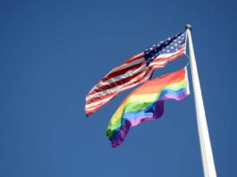 Pride flag flying alongside the star-spangled banner