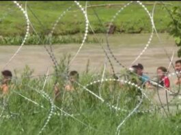 Migrants crossing the Rio Grande River