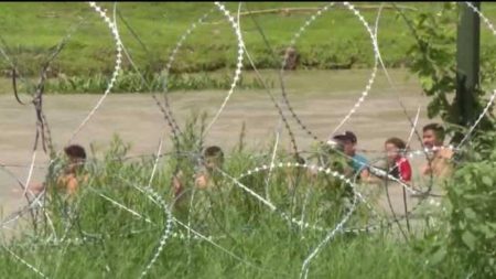 Migrants crossing the Rio Grande River