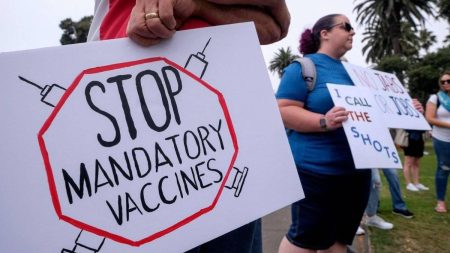 A mob of workers protesting enforcement of vaccine mandates