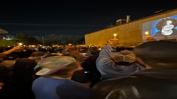 A picture of People gathered at a memorial