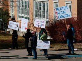 A picture of people protesting teaching slavery