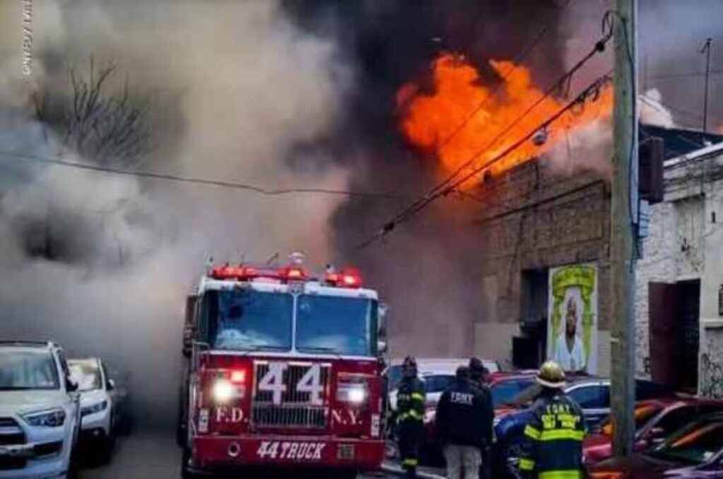 A Firetruck Outside the Burning Building