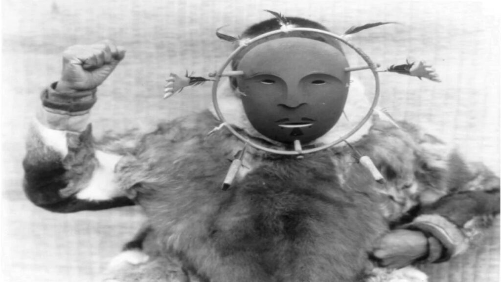A picture of a man wearing the Nunivak mask