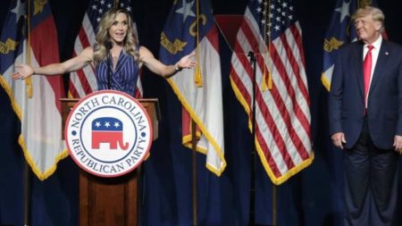 Donald standing by as Lara Trump addresses the audience