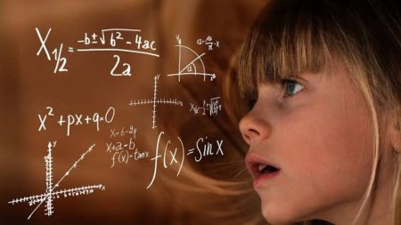 Young girl thinking on maths problems.